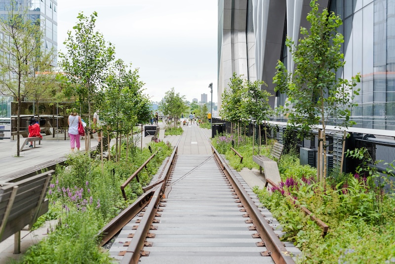 a train tracks leading up to a building