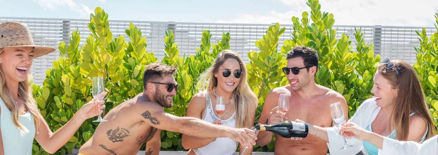 a group of people drinking wine