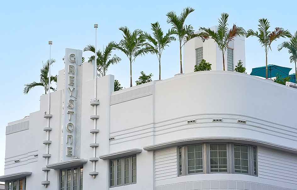 a building with palm trees on top