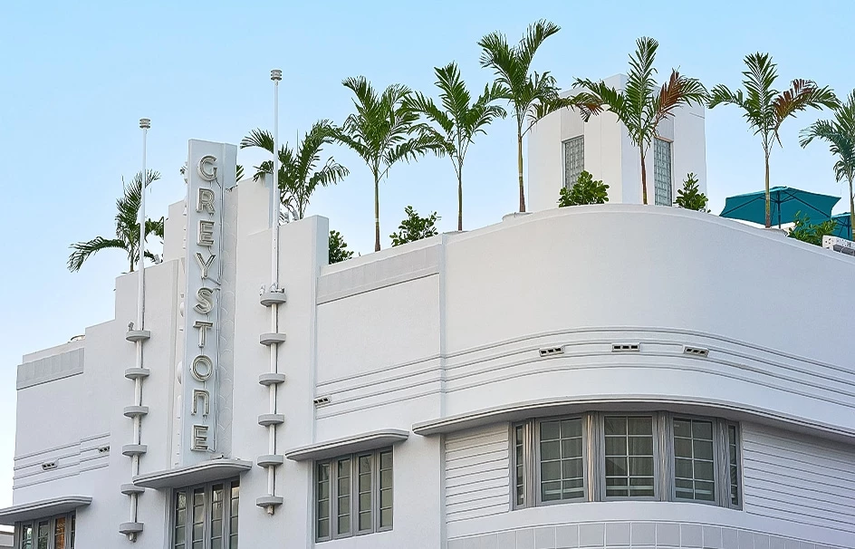a building with palm trees on top