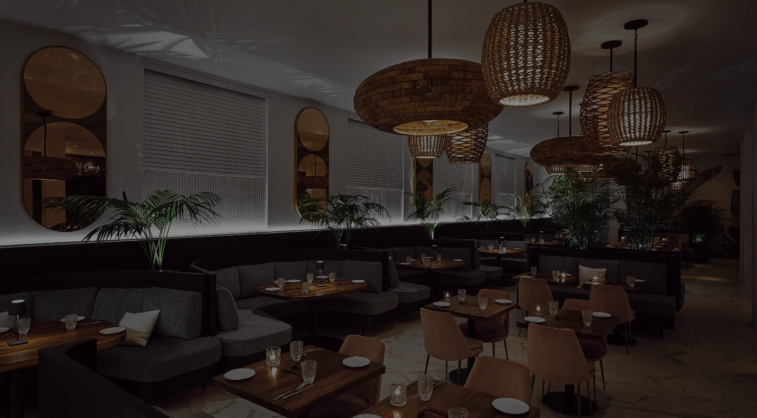 a dimly lit restaurant dining area with booths and tables