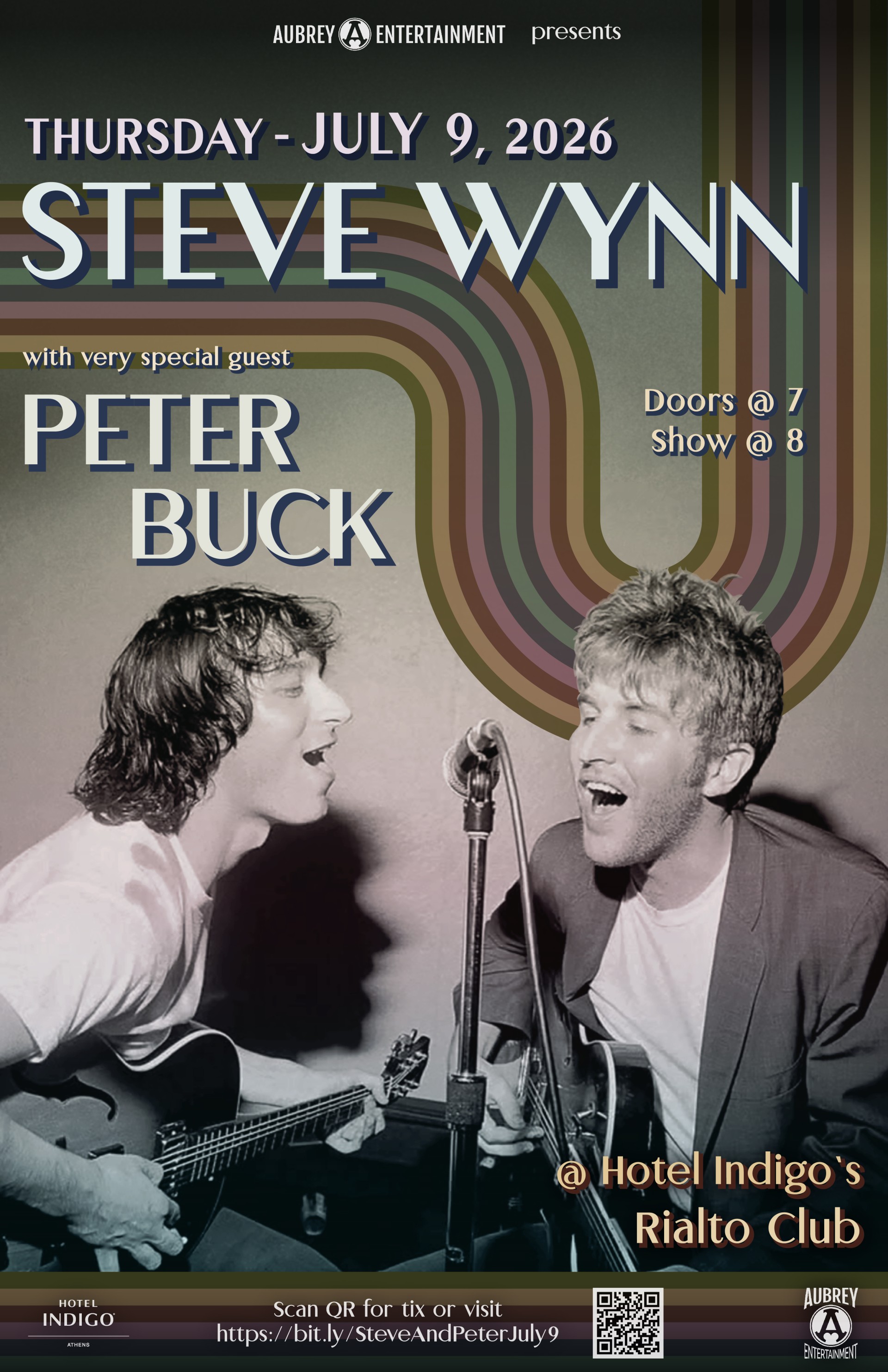 a couple of men singing into a microphone