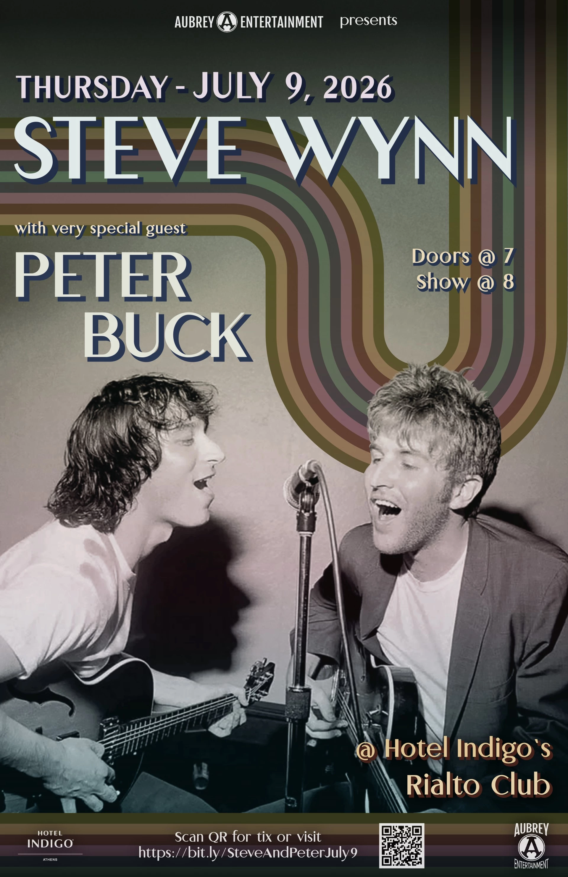a couple of men singing into a microphone