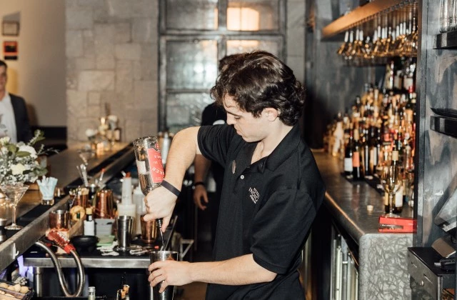 a man standing at a bar