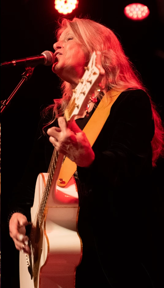 a person singing into a microphone