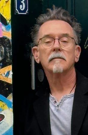 a man with glasses and a mustache