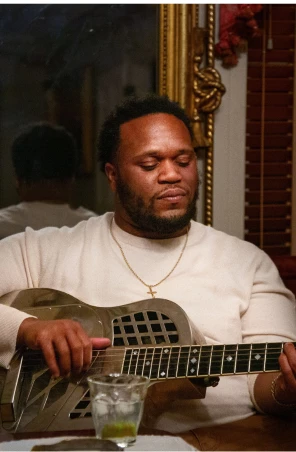 a man playing a guitar