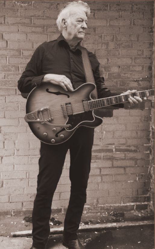 a man playing a guitar