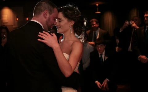 bride and groom sharing a dance at their wedding reception