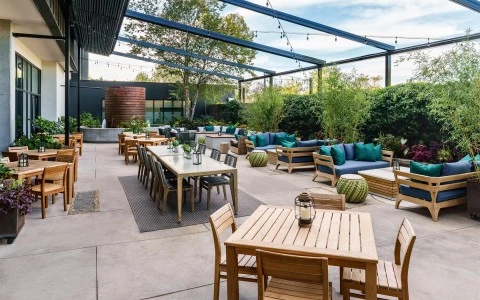 a patio with tables and chairs