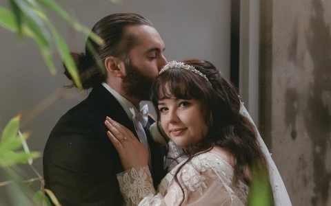 a man kissing a woman