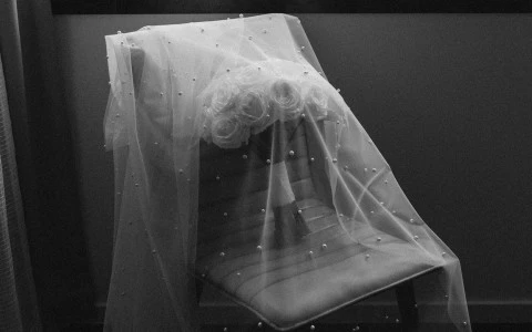 a black and white photo of a glass cube with a white substance