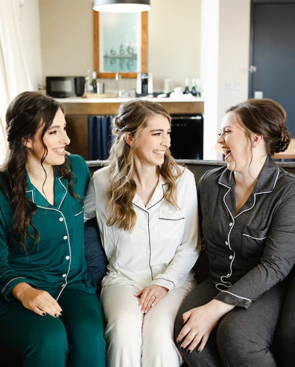 The bride and her bridesmaids getting ready