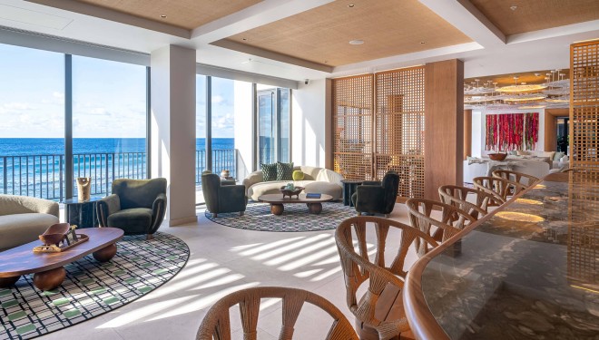 a room with a large window overlooking the ocean