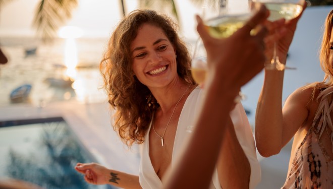 a woman smiling at a pool