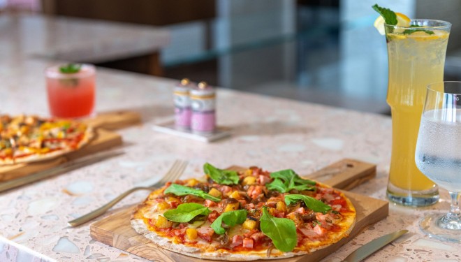 a pizza on a wooden board