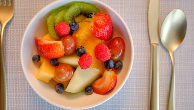 a bowl of fruit on a table