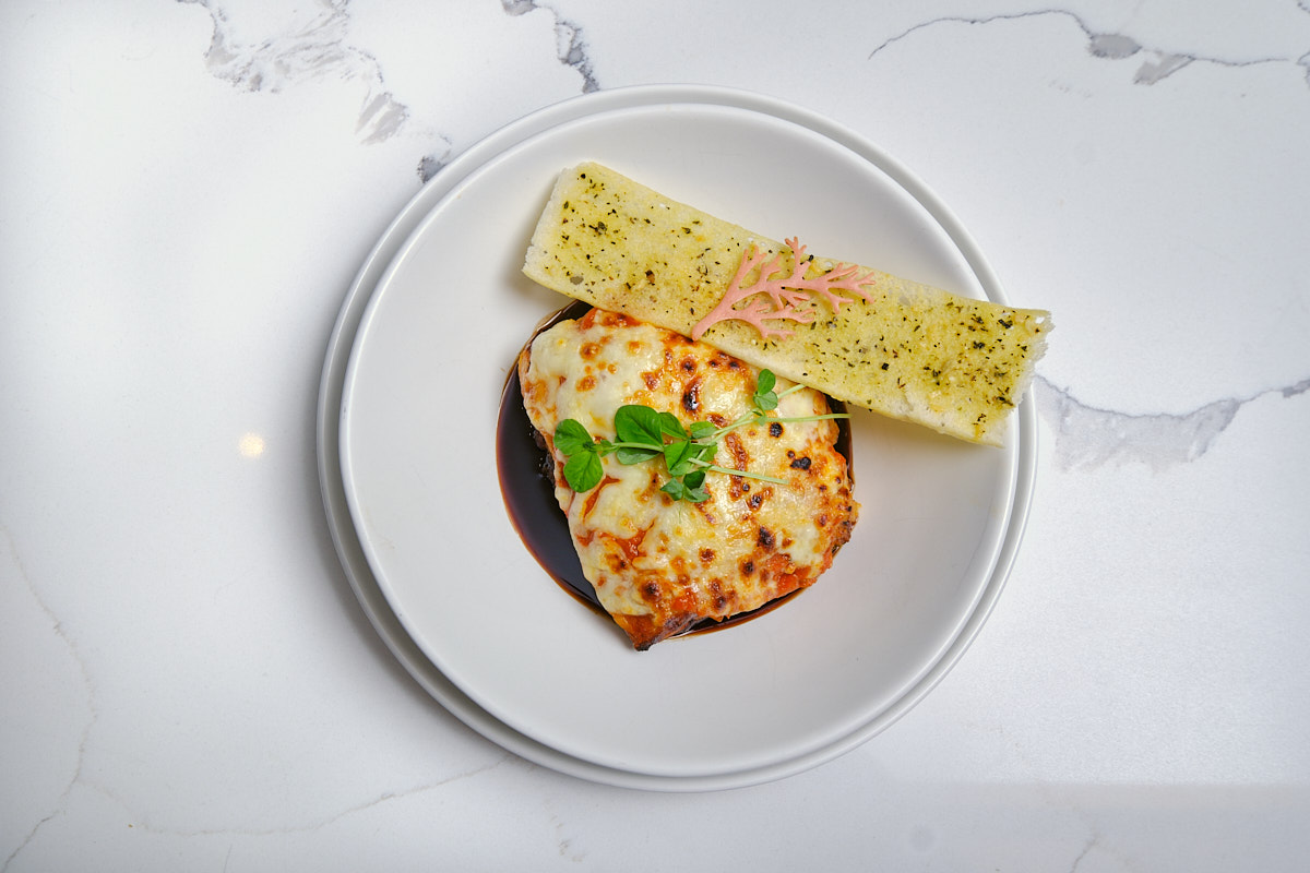 a plate of food on a marble table