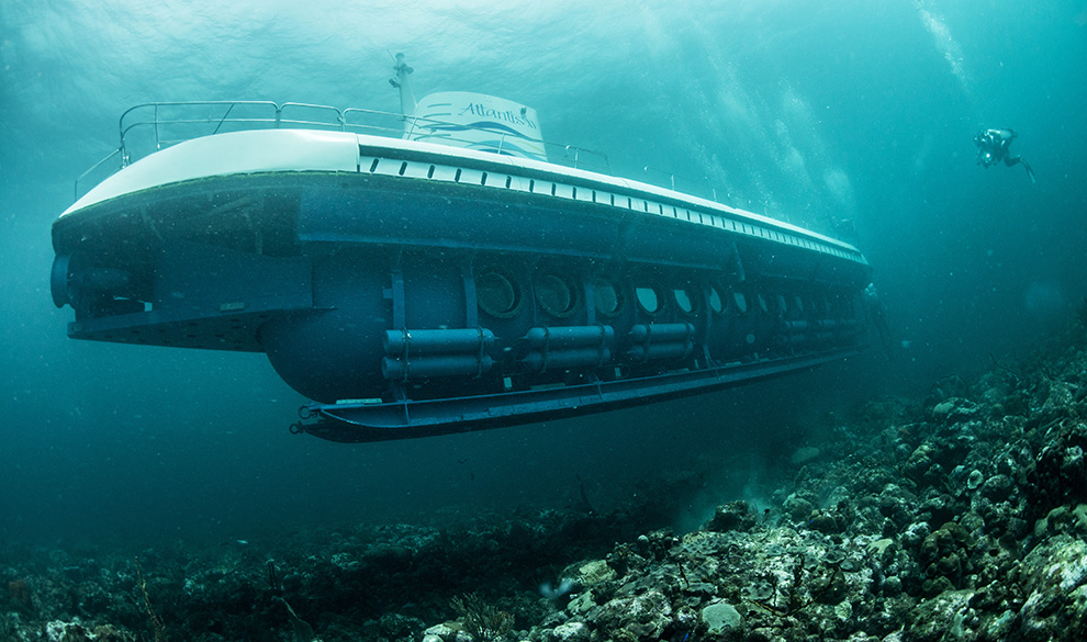 a boat under water with rocks and rocks