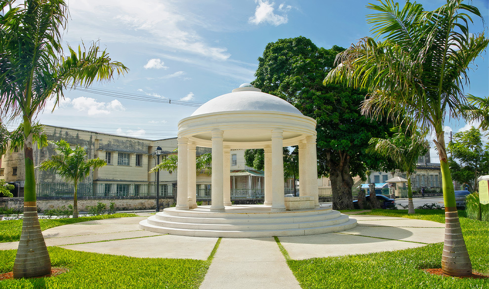 a white gazebo in a park