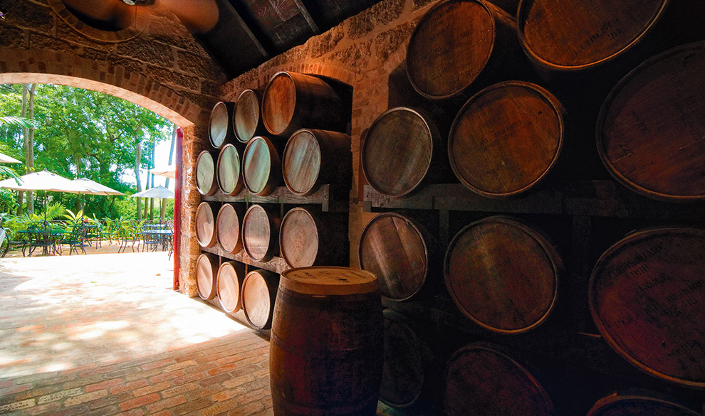 a group of barrels stacked on shelves