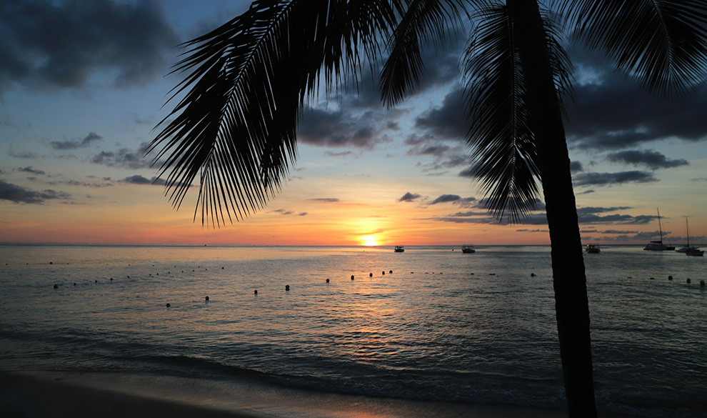 a sunset over a beach