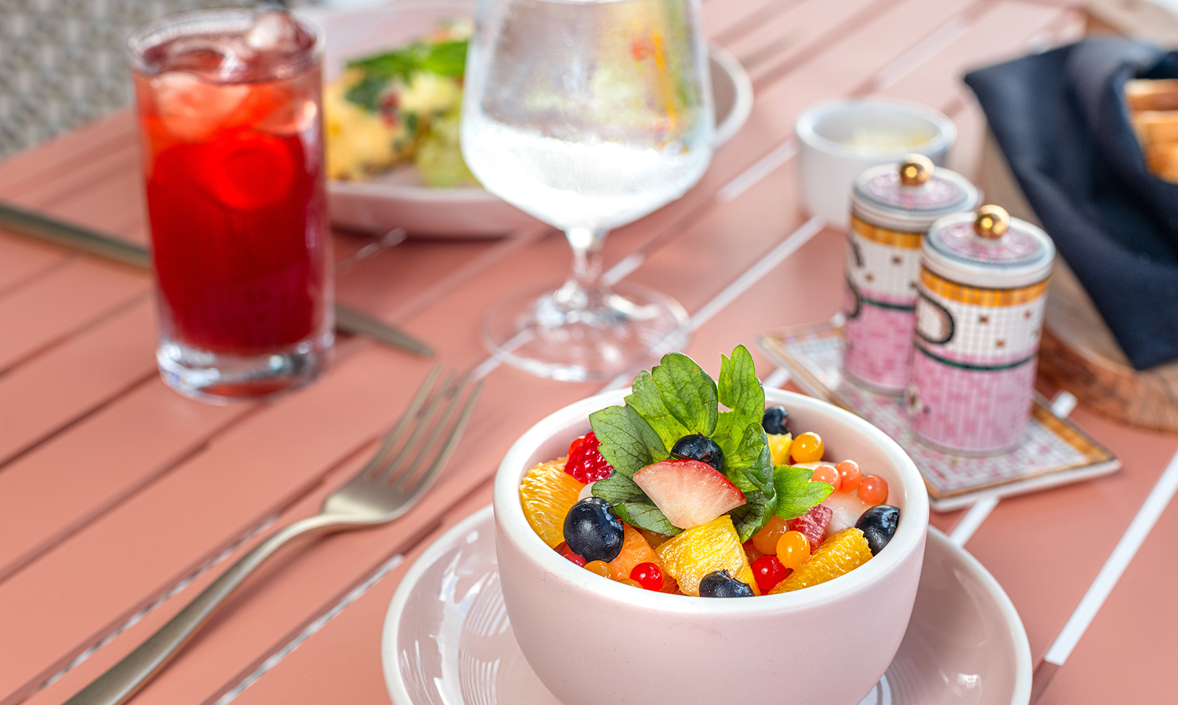 a bowl of fruit on a plate