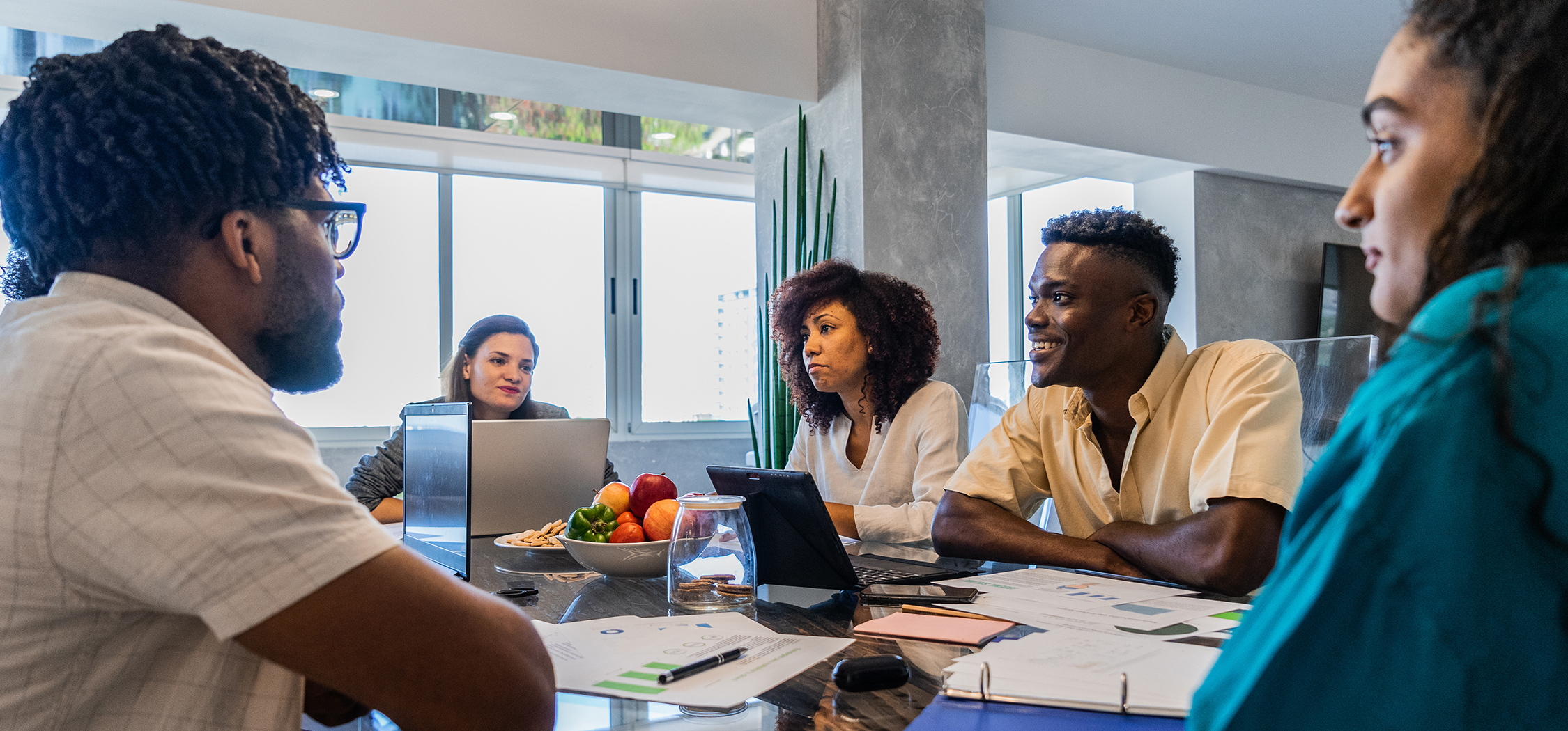 a group of people sitting around a table