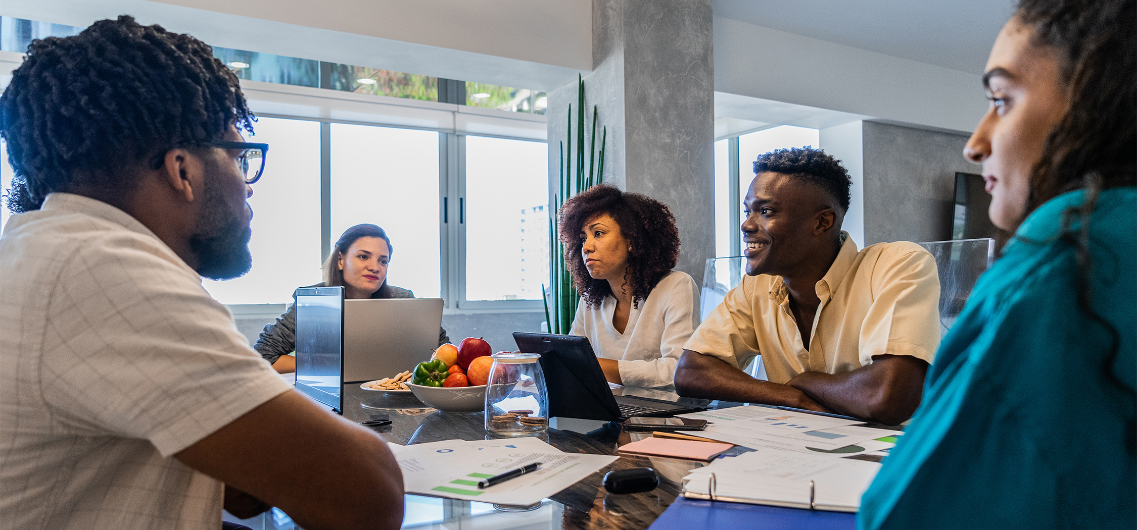a group of people sitting around a table