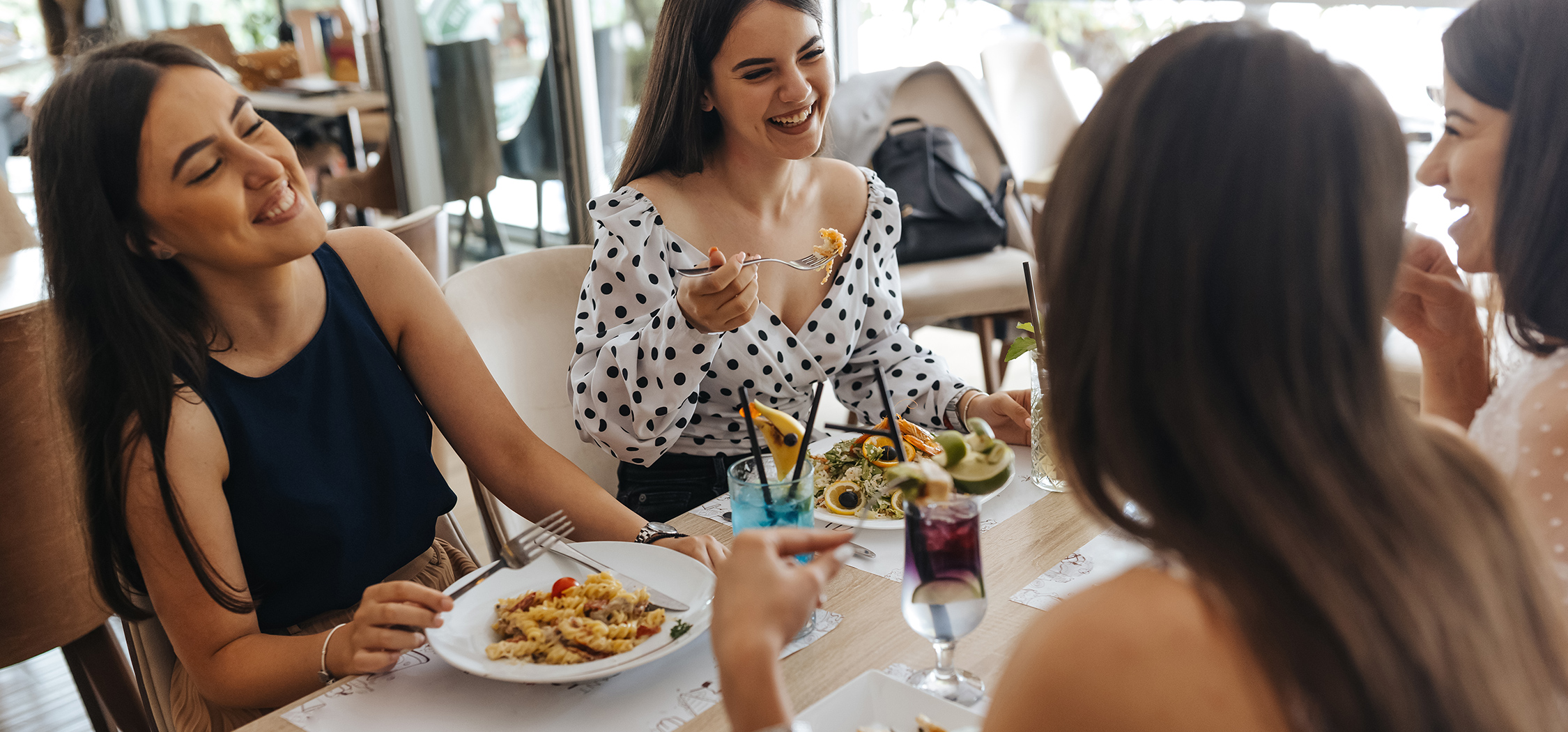 a group of people eating at a table