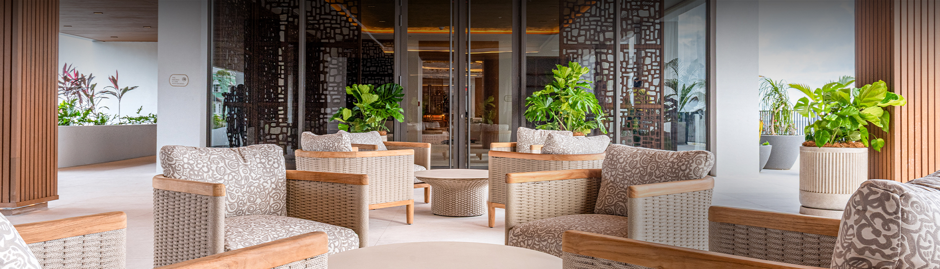a patio area with chairs and a table