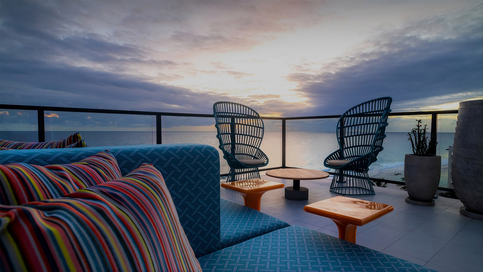 a deck with chairs and tables on a cloudy day
