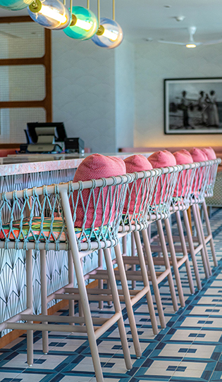 a row of pink chairs in a row