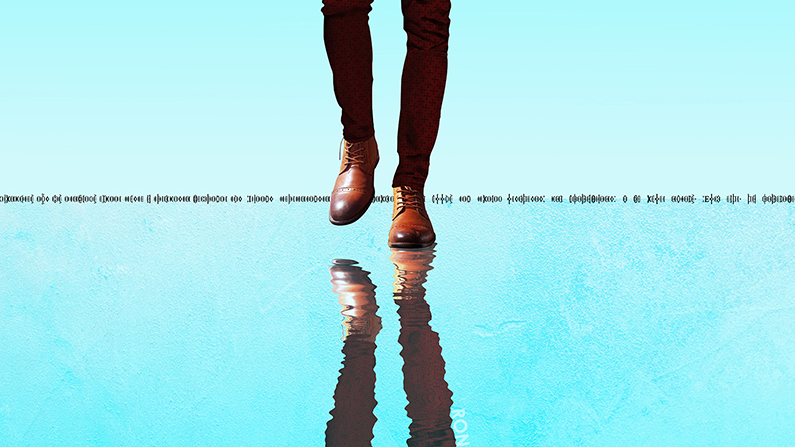 a person's legs walking on a puddle
