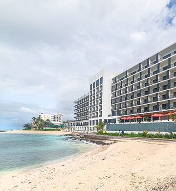 a building next to the beach
