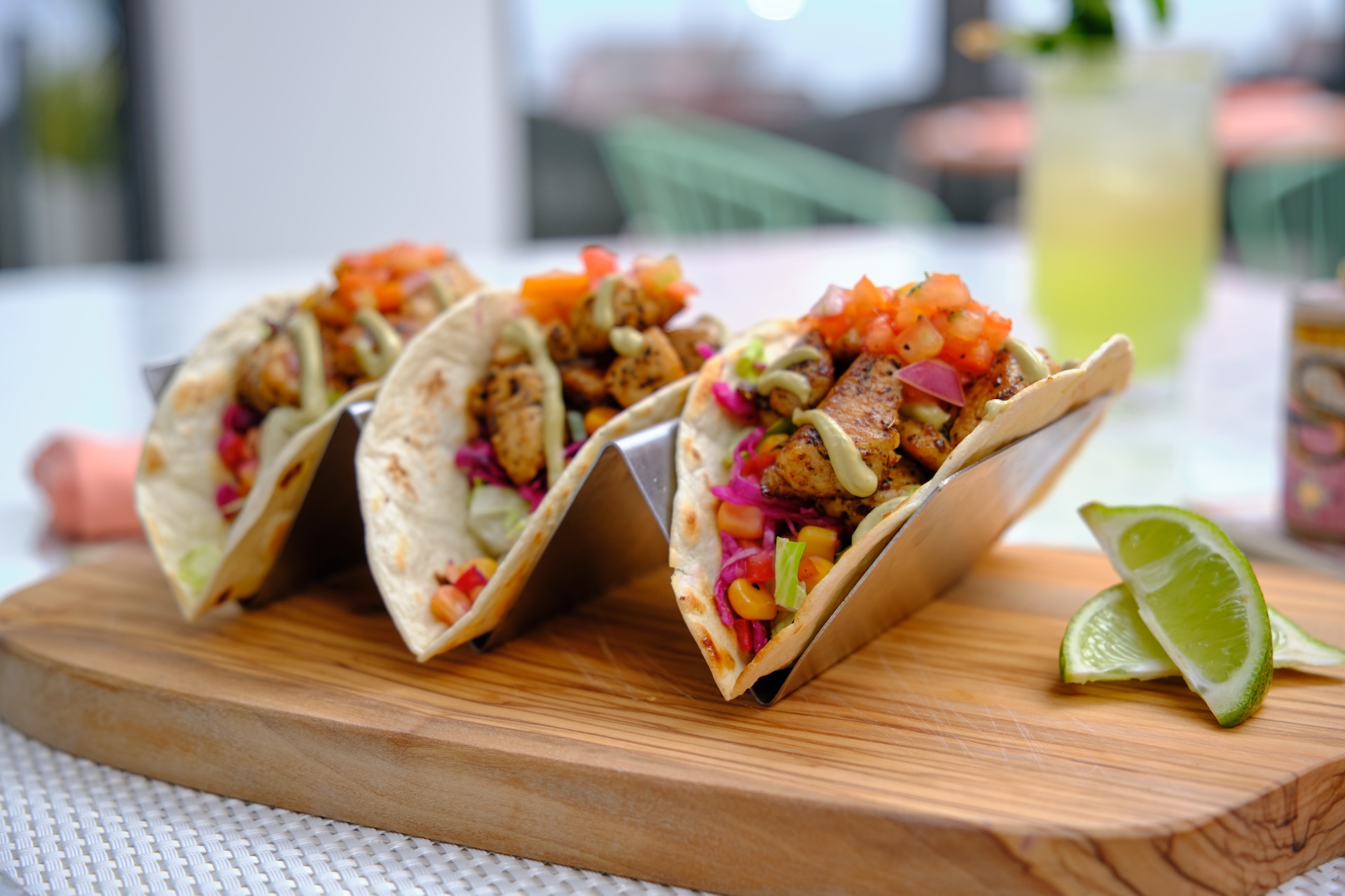 a group of tacos on a wooden board