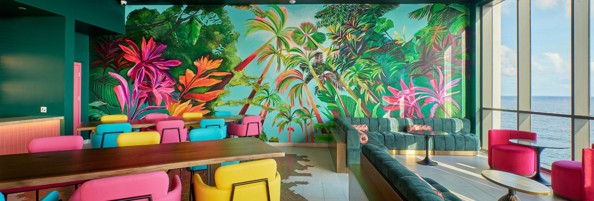 a room with a mural of trees and flowers