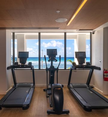 a room with treadmills and exercise machines