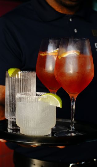a group of glasses with liquid in them