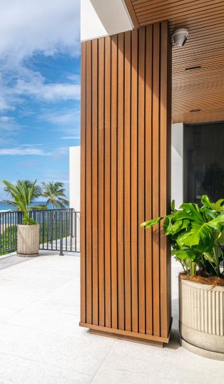 a wood pillar with plants in pots