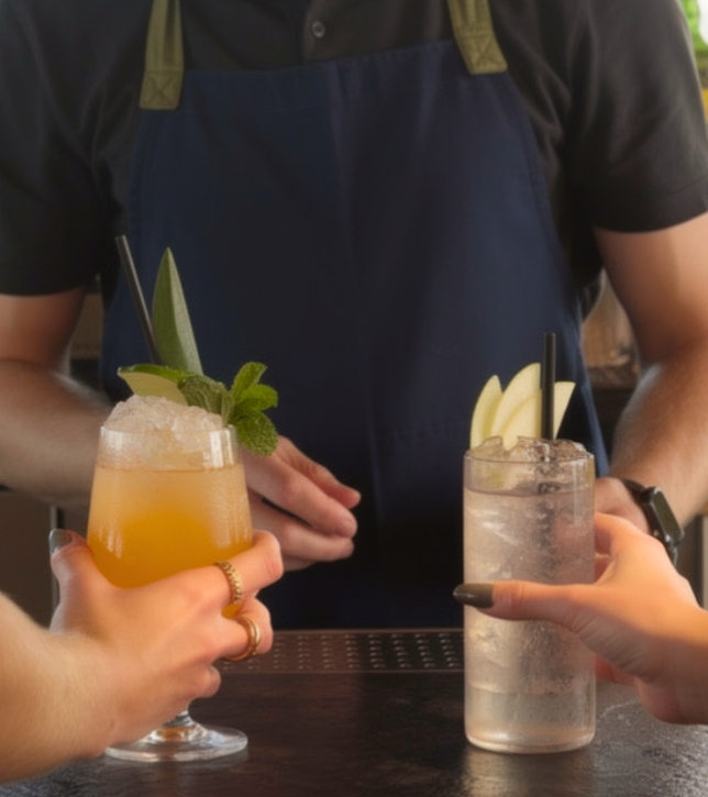 a person holding drinks with a person holding them
