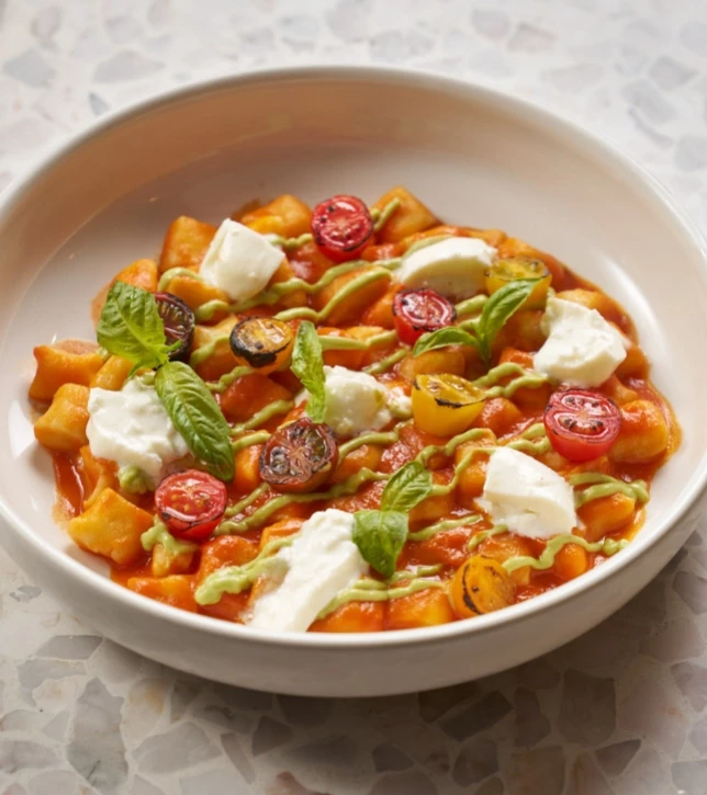 a bowl of food on a marble surface