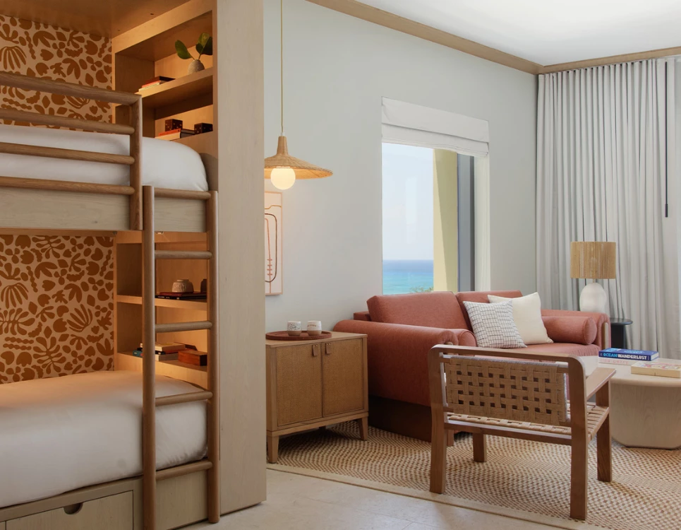 a room with a bunk bed and a couch