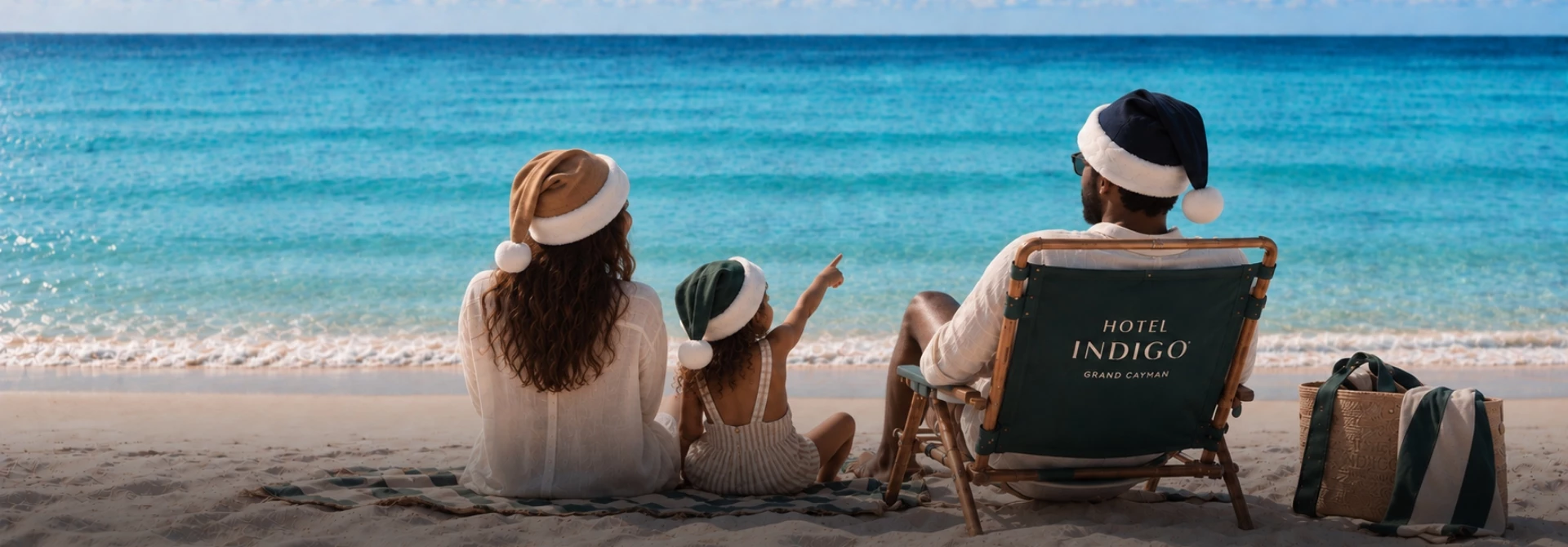 a family sitting on the beach