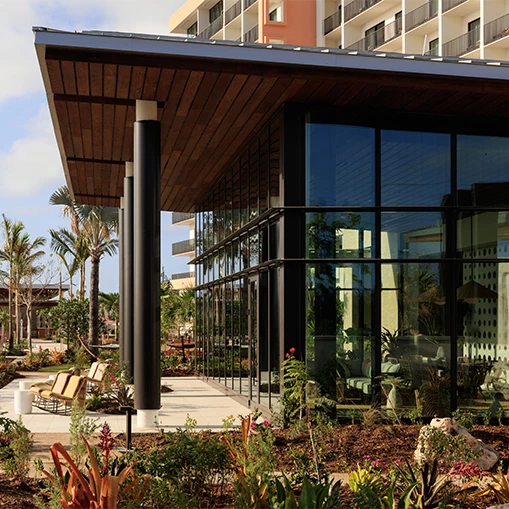 a building with a glass wall and a large building with a large building