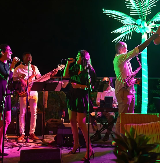 a group of people singing and playing instruments
