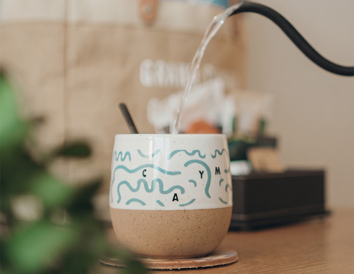 a water pouring into a cup