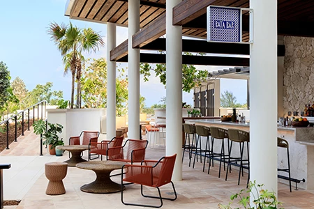 a patio with chairs and tables