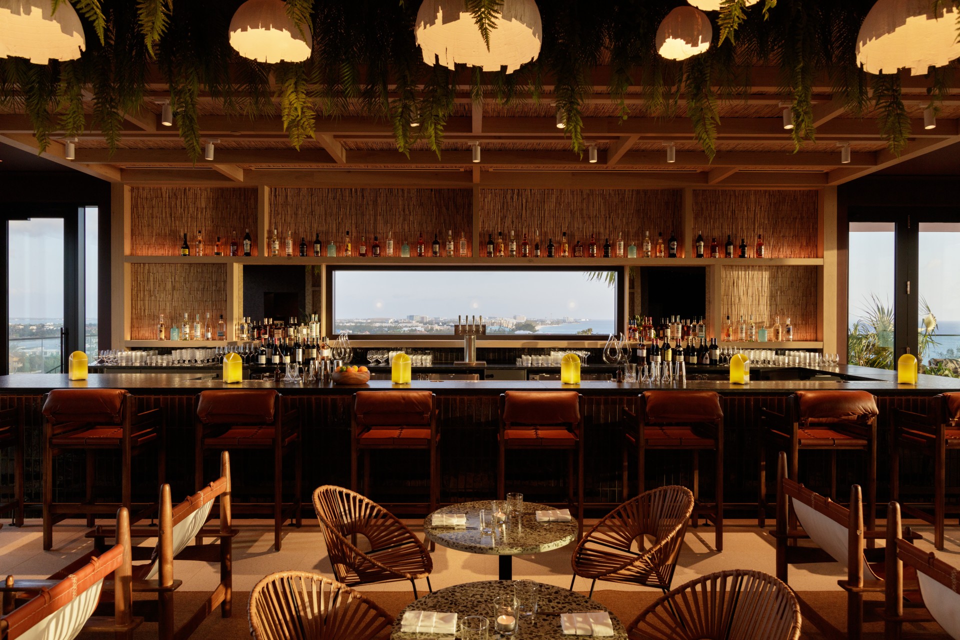 a bar with chairs and tables