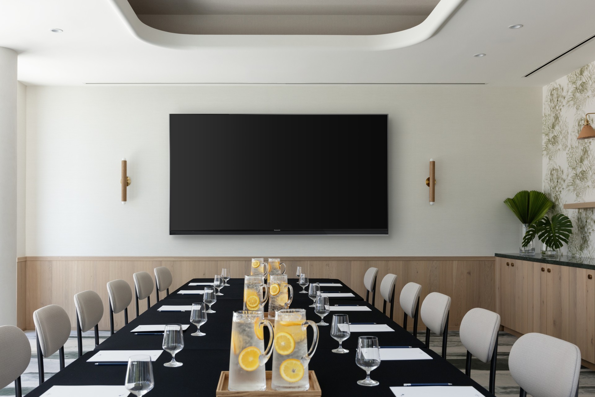 a table with glasses and lemons on it